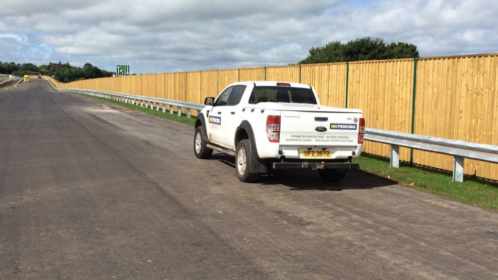 Acoustic reflective barrier