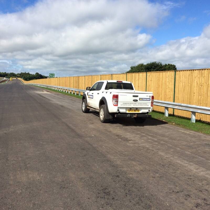 Acoustic reflective barrier